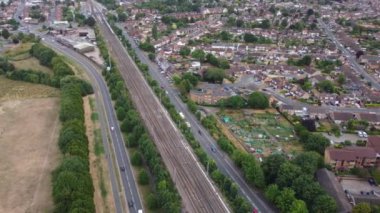 Train moving on Tracks at Sunset Time, the footage was captured at Leagrave Luton Station of England at a Beautiful Sunset Time, Trains is Passing from British City
