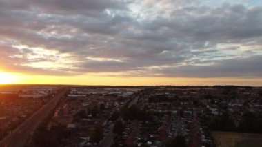 Train moving on Tracks at Sunset Time, the footage was captured at Leagrave Luton Station of England at a Beautiful Sunset Time, Trains is Passing from British City