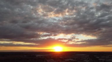 Train moving on Tracks at Sunset Time, the footage was captured at Leagrave Luton Station of England at a Beautiful Sunset Time, Trains is Passing from British City