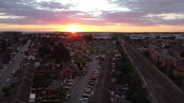 Train moving on Tracks at Sunset Time, the footage was captured at Leagrave Luton Station of England at a Beautiful Sunset Time, Trains is Passing from British City