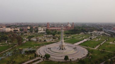 The Historical Tower of Pakistan, Minar e Pakistan at Lahore City of Punjab Pakistan.  The tower is located in the middle of an urban park, The tower was built between 1960 and 1968  clipart