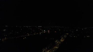Live Fireworks over Luton Town of England on a Weeding Night, Drone's Night Flight over Luton Town of England. it was Asian wedding when they were enjoying the party and live fireworks, (high angle view with drone's camera)