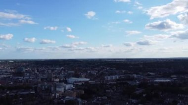 Aerial view of British Town Centre of Luton England with Railway Station and Train on Track