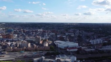 Aerial view of British Town Centre of Luton England with Railway Station and Train on Track
