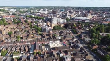 Aerial view of British Town Centre of Luton England with Railway Station and Train on Track