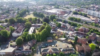 Aerial view of British Town Centre of Luton England with Railway Station and Train on Track