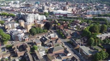 Aerial view of British Town Centre of Luton England with Railway Station and Train on Track