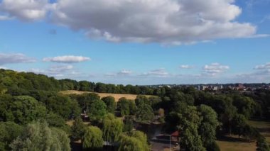 Water Birds are Swimming in the Lake Water of Local Public Park of Luton England Great Britain on a hot Day of Summer 2022, Drone's Camera Footage.