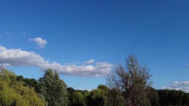 Water Birds are Swimming in the Lake Water of Local Public Park of Luton England Great Britain on a hot Day of Summer 2022, Drone's Camera Footage.