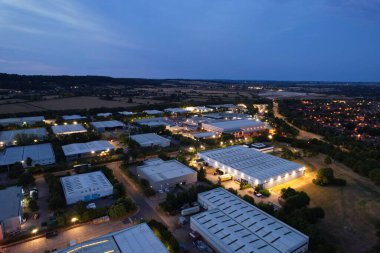 Aerial view of illuminated British City and Highway Roads at Night over England