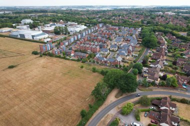 Aerial View of Caldecotte Lake at Sunset. A beautiful lake split across 2 sides, drone's high angle footage