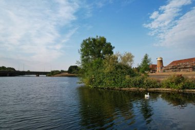 Aerial View of Caldecotte Lake at Sunset. A beautiful lake split across 2 sides, drone's high angle footage