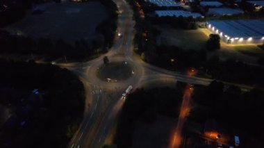 Illuminated Roads and Traffic over British City During Night