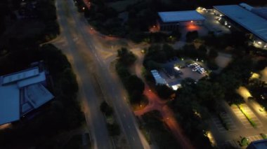 Illuminated Roads and Traffic over British City During Night