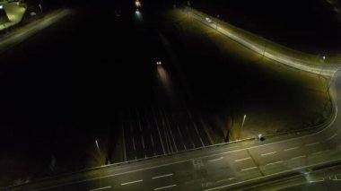 Illuminated Roads and Traffic over British City During Night
