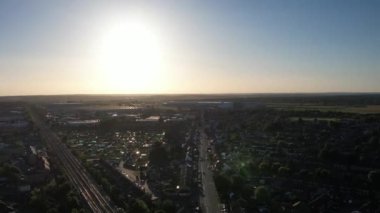 Aerial Footage of British City of Luton, England, Close to Leagrave Railway Station, Train on Tracks and Houses