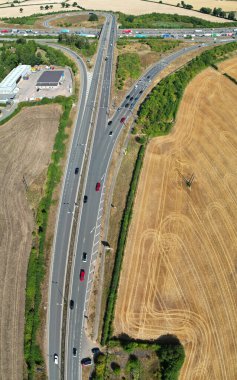 High Angle View of British Motorways at M1. Highways are Passing from Beautiful Landscape with agricultural farms