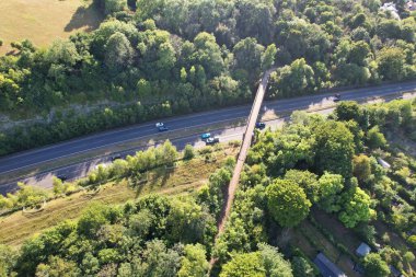 High Angle View of British Motorways at M1. Highways are Passing from Beautiful Landscape with agricultural farms