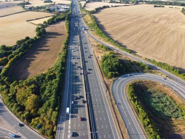 High Angle View of British Motorways at M1. Highways are Passing from Beautiful Landscape with agricultural farms