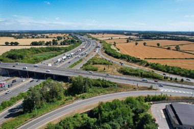 High Angle View of British Motorways at M1. Highways are Passing from Beautiful Landscape with agricultural farms