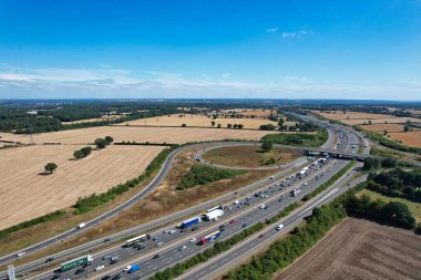 High Angle View of British Motorways at M1. Highways are Passing from Beautiful Landscape with agricultural farms