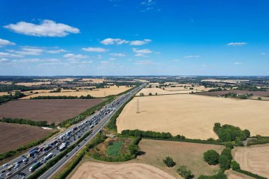 High Angle View of British Motorways at M1. Highways are Passing from Beautiful Landscape with agricultural farms