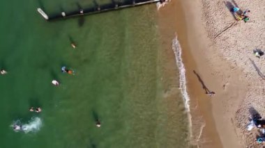Beautiful Aerial View of Sea View and Sandy Beach of Bournemouth City of England UK, Drone's footage. People are Enjoying hot weather of England on 18th July 2022