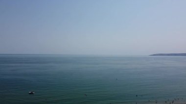 Beautiful Aerial View of Sea View and Sandy Beach of Bournemouth City of England UK, Drone's footage. People are Enjoying hot weather of England on 18th July 2022