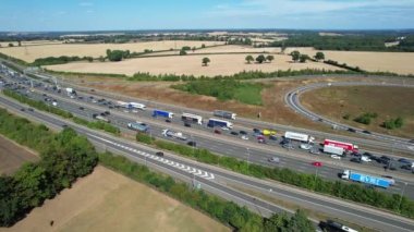 Aerial View of British Motorways With Traffic at Peak Time, High Angle Footage taken with drone's camera at Luton City of England UK, M1 J11 Motorways Junction Interchange.