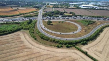 Aerial View of British Motorways With Traffic at Peak Time, High Angle Footage taken with drone's camera at Luton City of England UK, M1 J11 Motorways Junction Interchange.