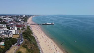 Beautiful Aerial View of Sea View and Sandy Beach of Bournemouth City of England UK, Drone's footage. People are Enjoying hot weather of England on 18th July 2022