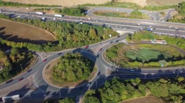 Aerial View of British Motorways With Traffic at Peak Time, High Angle Footage taken with drone's camera at Luton City of England UK, M1 J11 Motorways Junction Interchange.