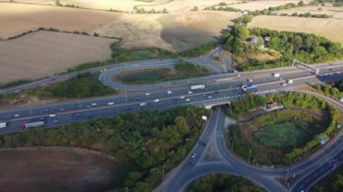 Aerial View of British Motorways With Traffic at Peak Time, High Angle Footage taken with drone's camera at Luton City of England UK, M1 J11 Motorways Junction Interchange.