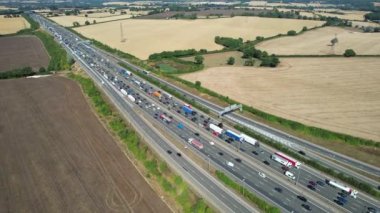 Aerial View of British Motorways With Traffic at Peak Time, High Angle Footage taken with drone's camera at Luton City of England UK, M1 J11 Motorways Junction Interchange.