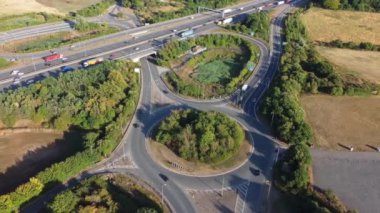 Aerial View of British Motorways With Traffic at Peak Time, High Angle Footage taken with drone's camera at Luton City of England UK, M1 J11 Motorways Junction Interchange.