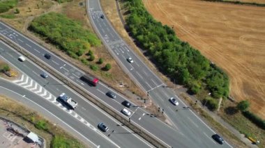 Aerial View of British Motorways With Traffic at Peak Time, High Angle Footage taken with drone's camera at Luton City of England UK, M1 J11 Motorways Junction Interchange.
