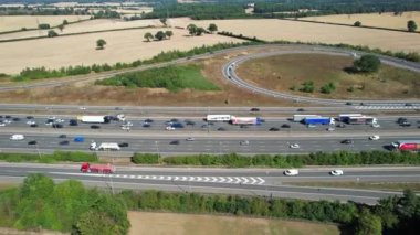 Aerial View of British Motorways With Traffic at Peak Time, High Angle Footage taken with drone's camera at Luton City of England UK, M1 J11 Motorways Junction Interchange.
