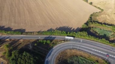 Aerial View of British Motorways With Traffic at Peak Time, High Angle Footage taken with drone's camera at Luton City of England UK, M1 J11 Motorways Junction Interchange.