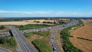 Aerial View of British Motorways With Traffic at Peak Time, High Angle Footage taken with drone's camera at Luton City of England UK, M1 J11 Motorways Junction Interchange.