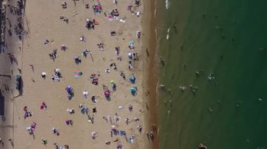 Beautiful Aerial View of Sea View and Sandy Beach of Bournemouth City of England UK, Drone's footage. People are Enjoying hot weather of England on 18th July 2022