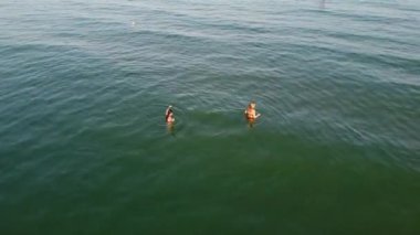 Beautiful Aerial View of Sea View and Sandy Beach of Bournemouth City of England UK, Drone's footage. People are Enjoying hot weather of England on 18th July 2022