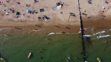 Beautiful Aerial View of Sea View and Sandy Beach of Bournemouth City of England UK, Drone's footage. People are Enjoying hot weather of England on 18th July 2022