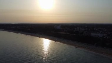 Beautiful Aerial View of Sea View and Sandy Beach of Bournemouth City of England UK, Drone's footage. People are Enjoying hot weather of England on 18th July 2022