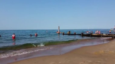 Beautiful Aerial View of Sea View and Sandy Beach of Bournemouth City of England UK, Drone's footage. People are Enjoying hot weather of England on 18th July 2022