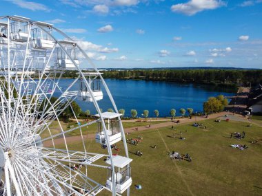 High Angle Footage of Willen Lake, Water Sports and Public Park of England. which is located at Milton Keynes, England.+ People are Enjoying at Lake on a Hot Sunny Day of Summer. Video Clip Captured on 21-Aug-2022. Beautiful Aerial Drone's Footage.