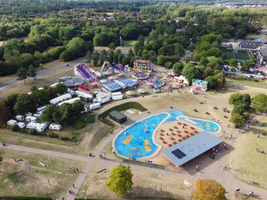 High Angle Footage of Willen Lake, Water Sports and Public Park of England. which is located at Milton Keynes, England.+ People are Enjoying at Lake on a Hot Sunny Day of Summer. Video Clip Captured on 21-Aug-2022. Beautiful Aerial Drone's Footage.