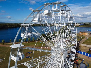 High Angle Footage of Willen Lake, Water Sports and Public Park of England. which is located at Milton Keynes, England.+ People are Enjoying at Lake on a Hot Sunny Day of Summer. Video Clip Captured on 21-Aug-2022. Beautiful Aerial Drone's Footage.