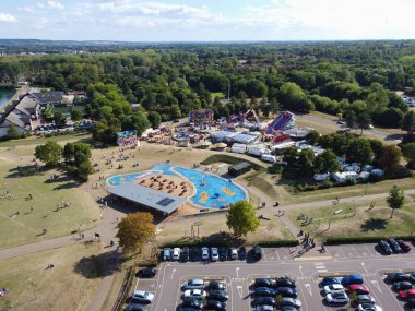 High Angle Footage of Willen Lake, Water Sports and Public Park of England. which is located at Milton Keynes, England.+ People are Enjoying at Lake on a Hot Sunny Day of Summer. Video Clip Captured on 21-Aug-2022. Beautiful Aerial Drone's Footage.