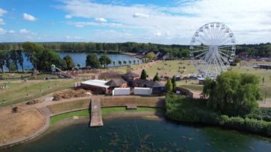 High Angle Footage of Willen Lake, Water Sports and Public Park of England. Beautiful Aerial Drone's Camera  Footage of Willen Lake and Park which is located at Milton Keynes, England.