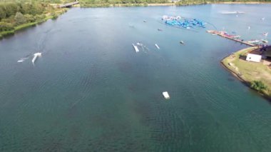 High Angle Footage of Willen Lake, Water Sports and Public Park of England. Beautiful Aerial Drone's Camera  Footage of Willen Lake and Park which is located at Milton Keynes, England.